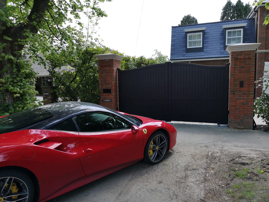 The Abbey aluminium bell curve automatic double swing gate in black powder-coated finish