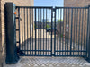 Commercial bi-folding speed gate with fast-opening  panels for secure vehicle access