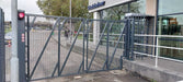 Bi-folding steel speed gate with mesh infill for secure site access