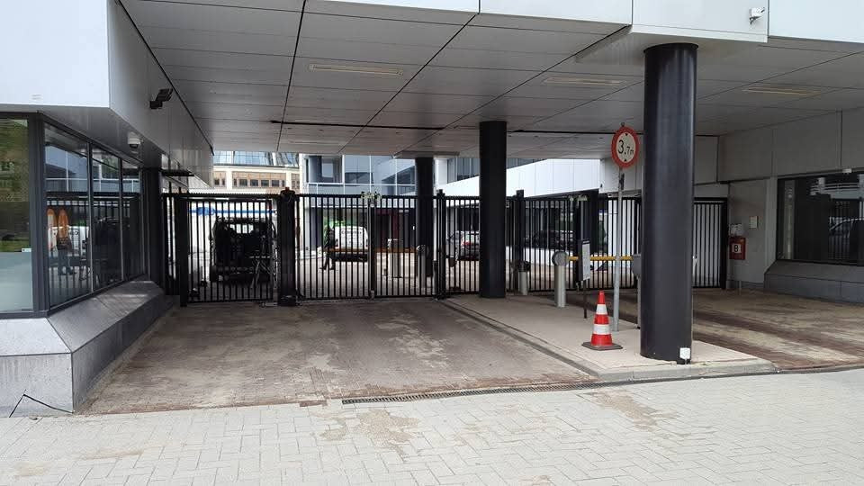 Twin-lane bi-fold speed gate system with steel bar infill for high-security access